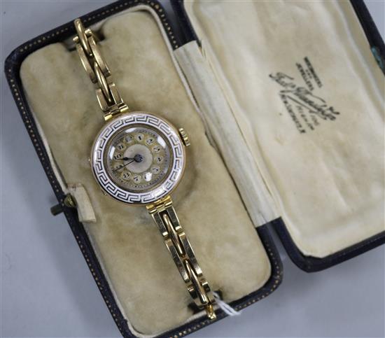 A ladys early 20th century 9ct gold and enamel manual wind wrist watch.